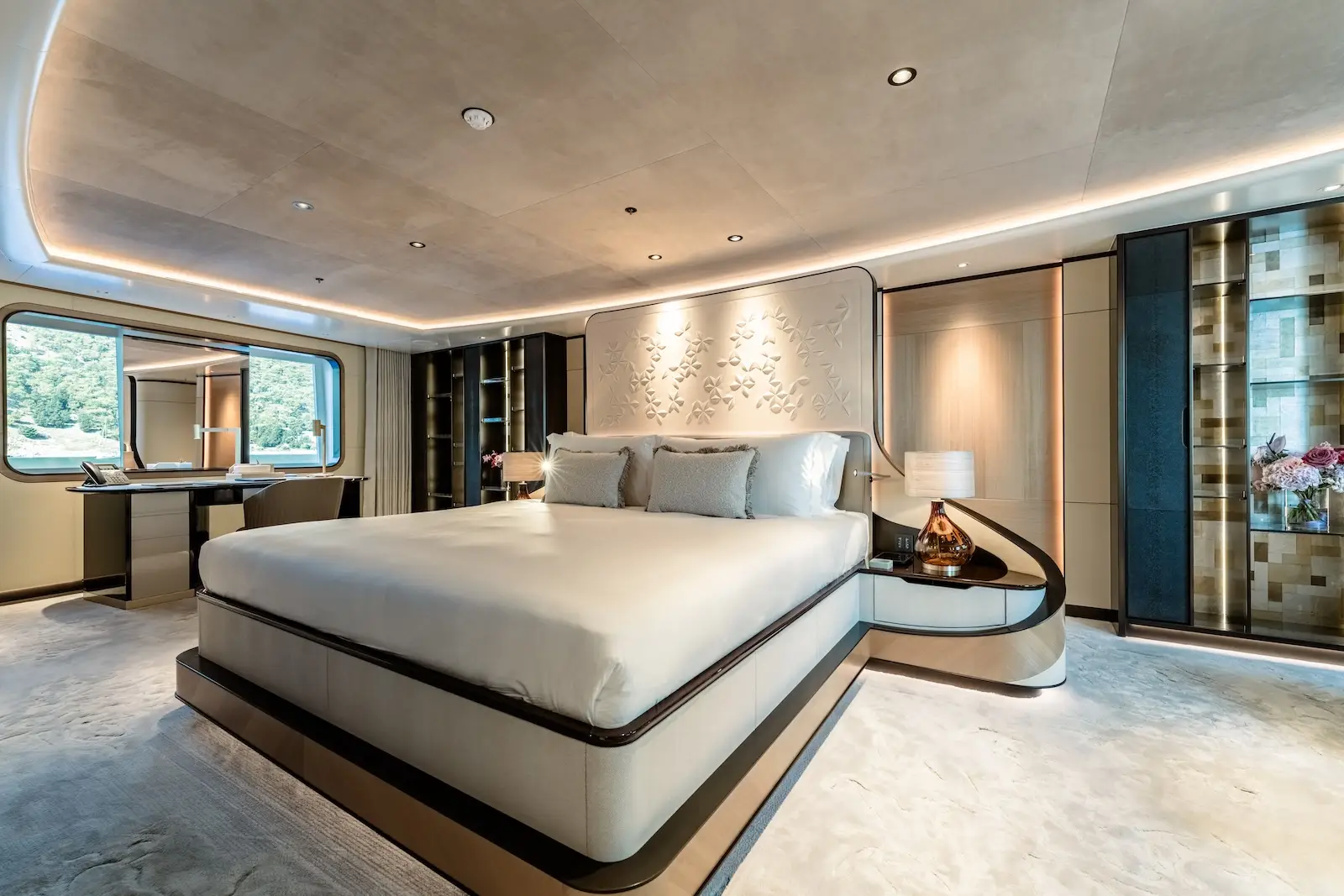 Owner's suite, bed facing a wide glazed band