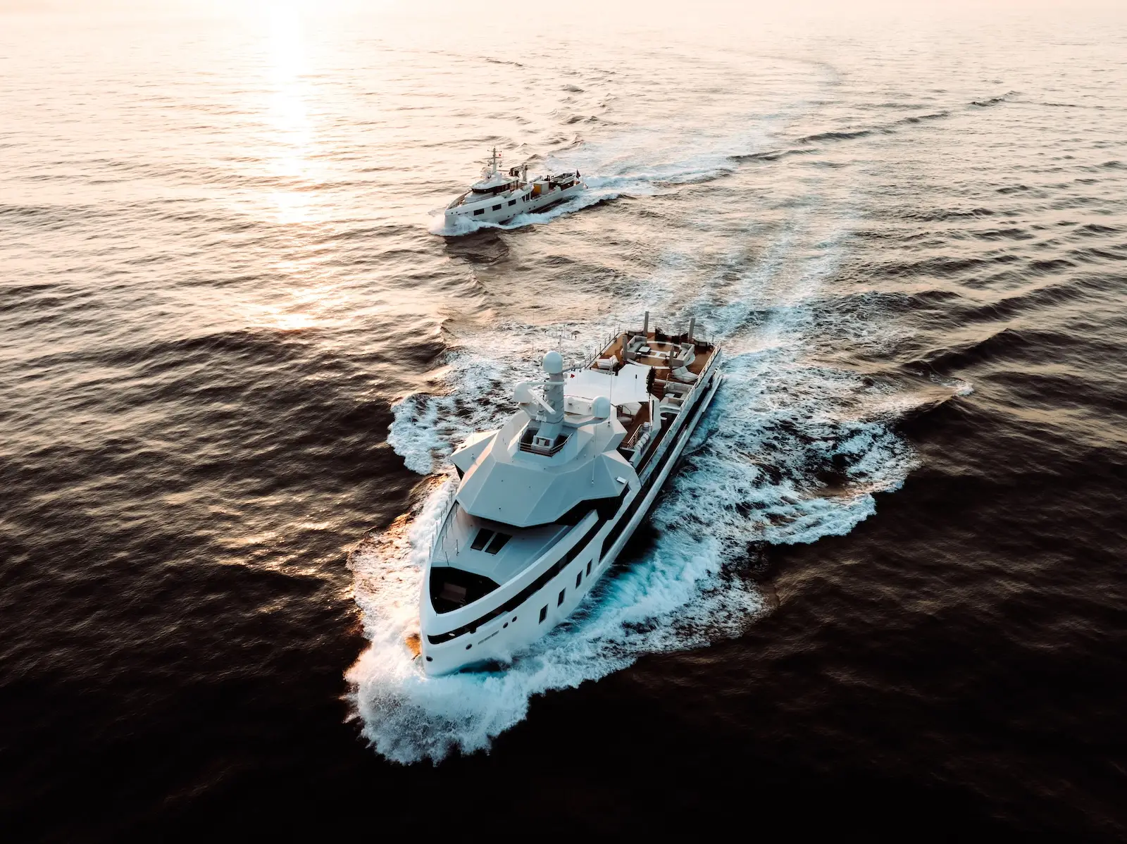 Sunset aerial of AFTER YOU and her support vessel underway on a long wake